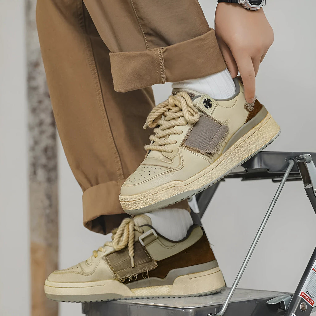 Beige microfiber skateboard shoes with flat rubber sole and lace-up closure
