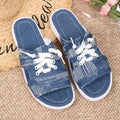 Blue Roman-style women's canvas slippers with rubber soles showing flat design and cloth upper material