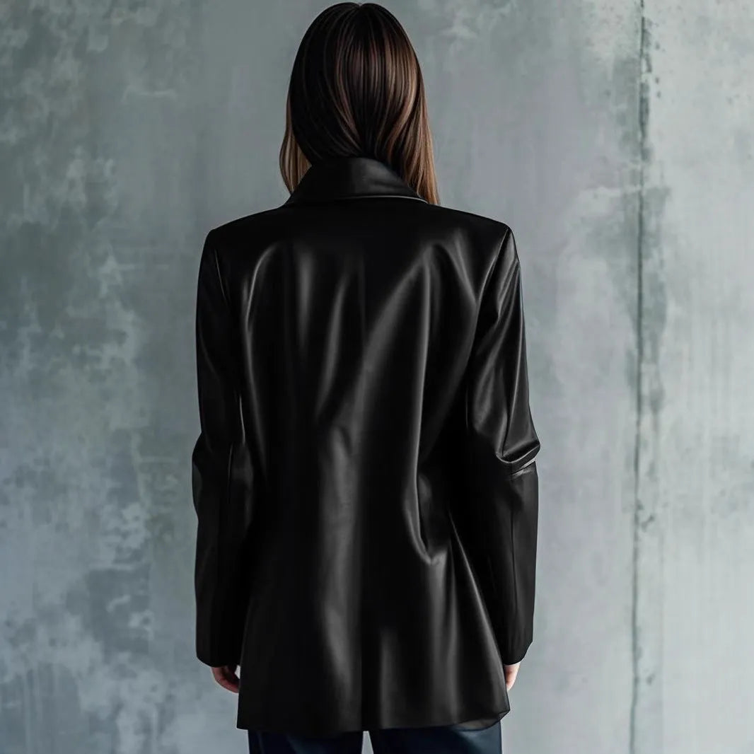 Women's solid black leather jacket with long sleeves, medium 65cm length, on a hanger.