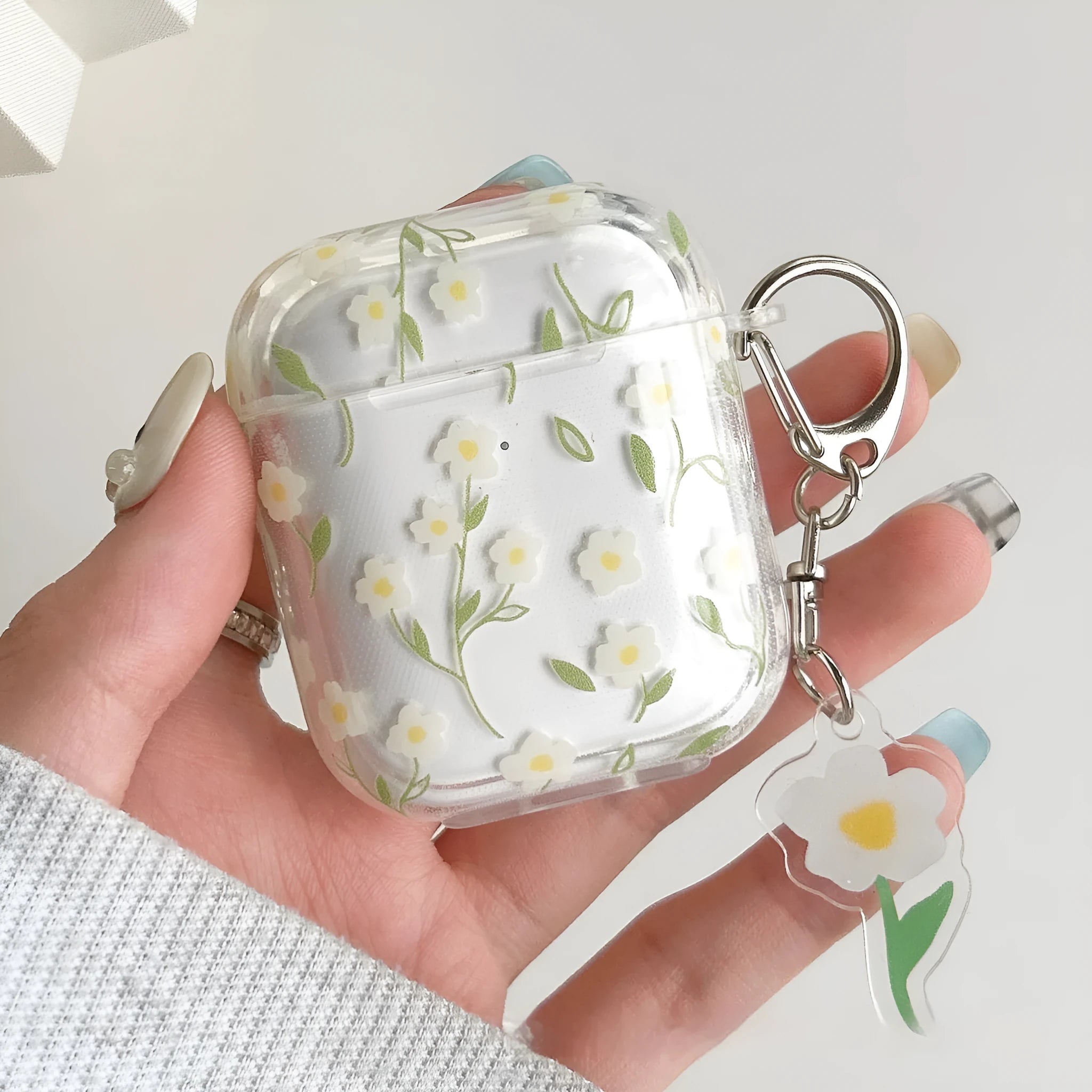 White floral transparent TPU protective case for Apple AirPods charging case.