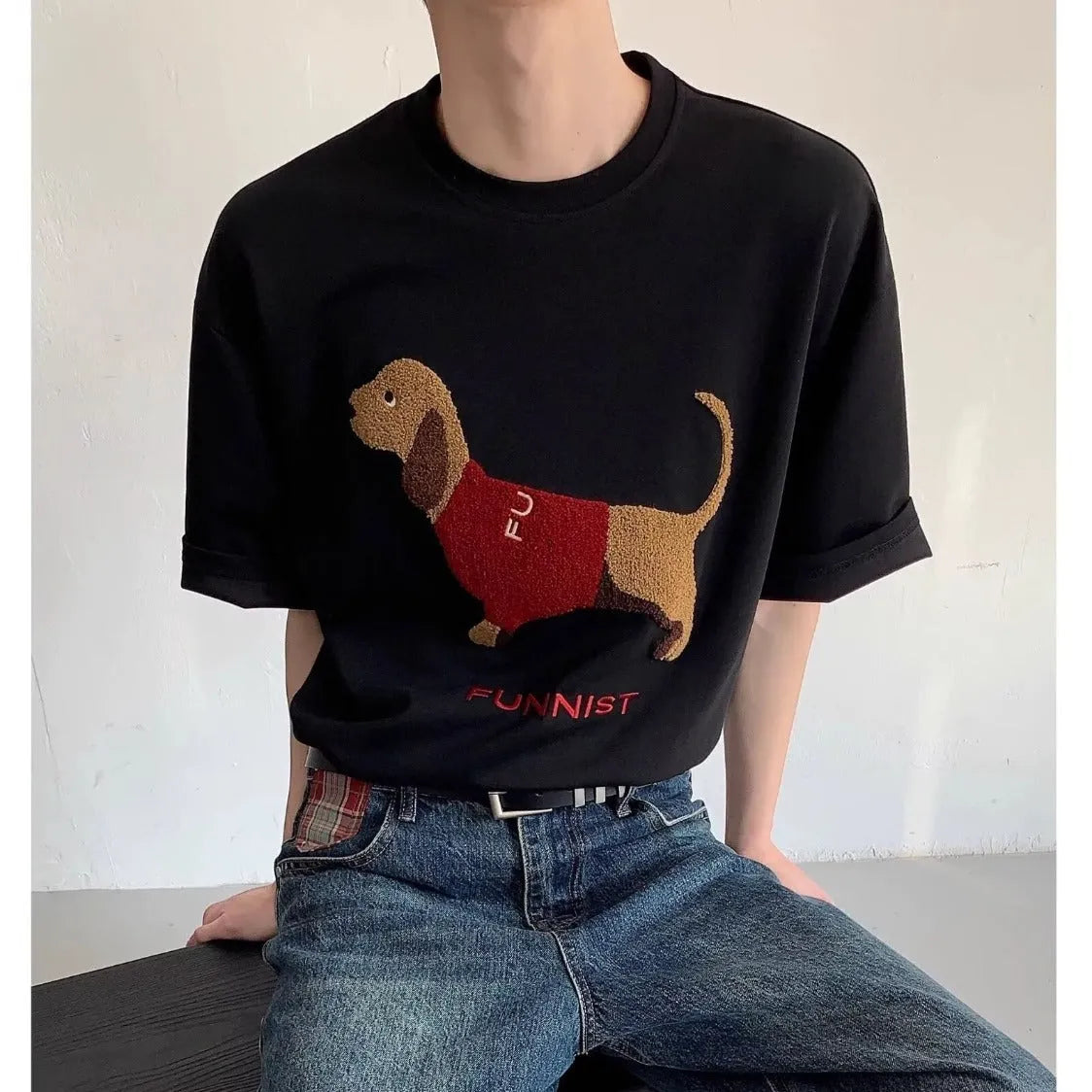 Grey men's T-shirt with a raised towel embroidery sausage dog design on the chest.