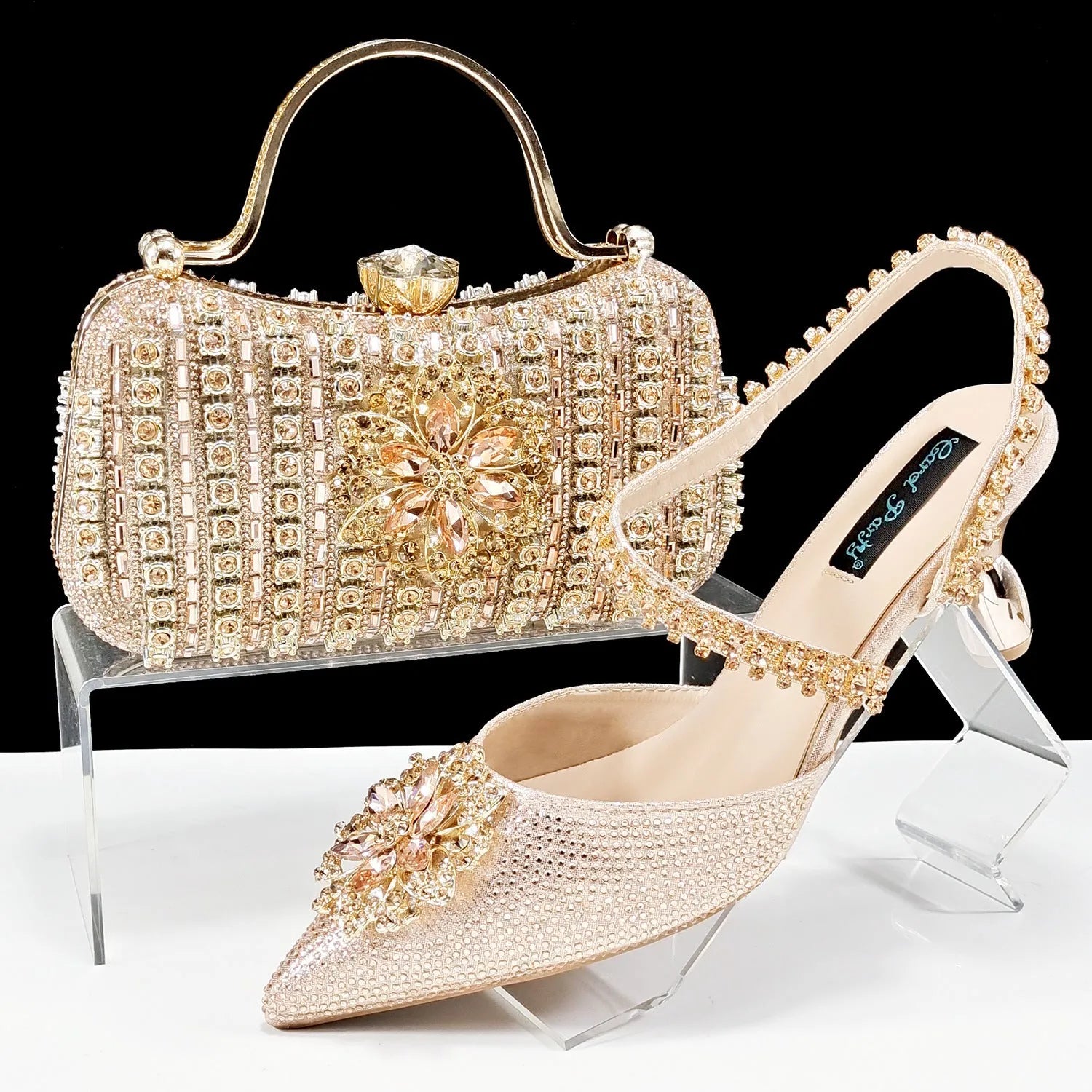 Women's black high heel shoes with matching clutch bag, decorative drill buckle flower ankle chain, and rhinestone details.
