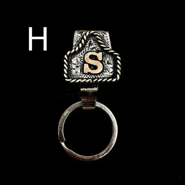 Handmade metal cow tag belt key holder with personalised alphabet letter