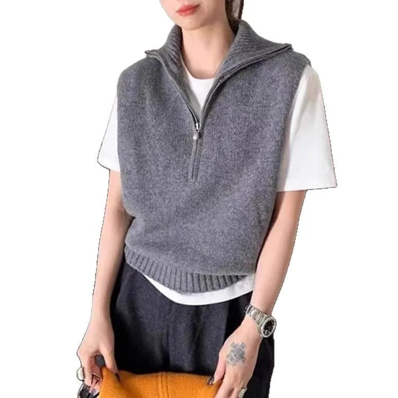Women's sleeveless half-zip knit vest in mesh fabric, shown in a solid colour with a 3D pattern.