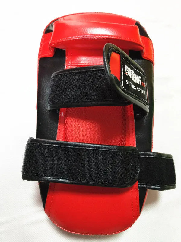Black with red edges square martial arts hand target pad with a buckle strap.