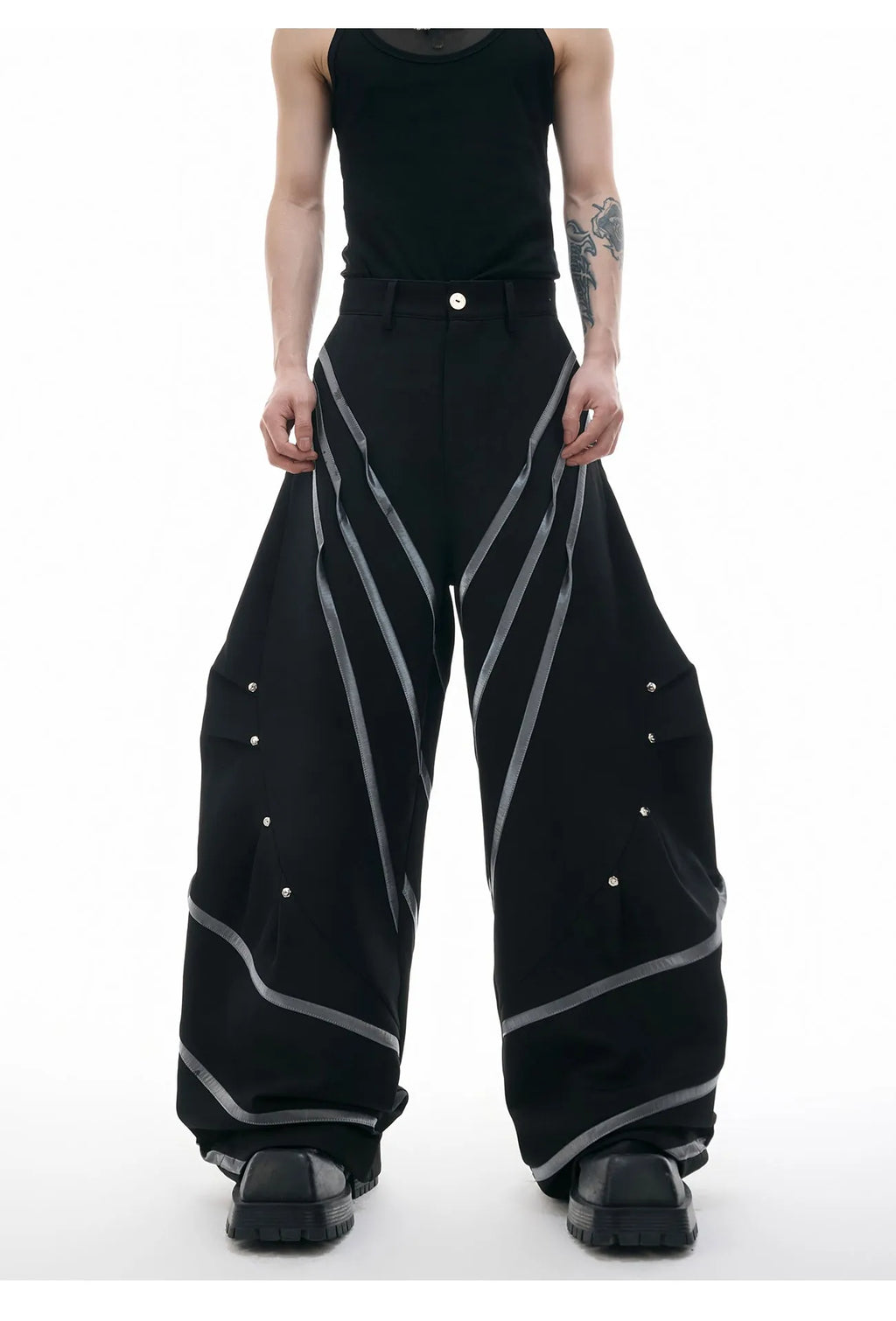 Men's black and white polyester trousers with three-dimensional cut and metal striped rivet pleats
