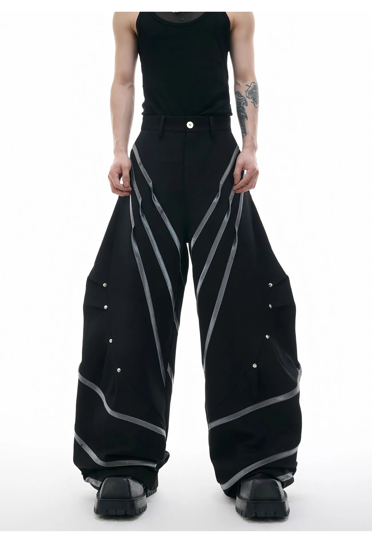 Men's black and white polyester trousers with three-dimensional cut and metal striped rivet pleats