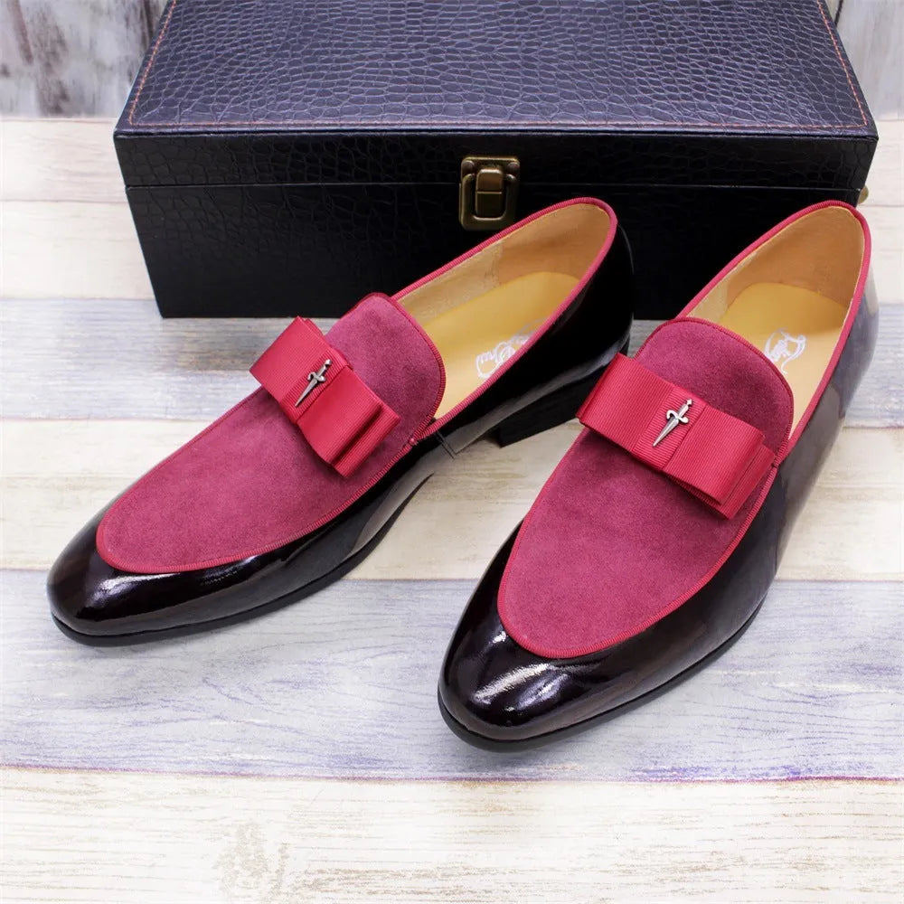 Men's black patent leather low-top dress shoes with a tassel detail on the front.