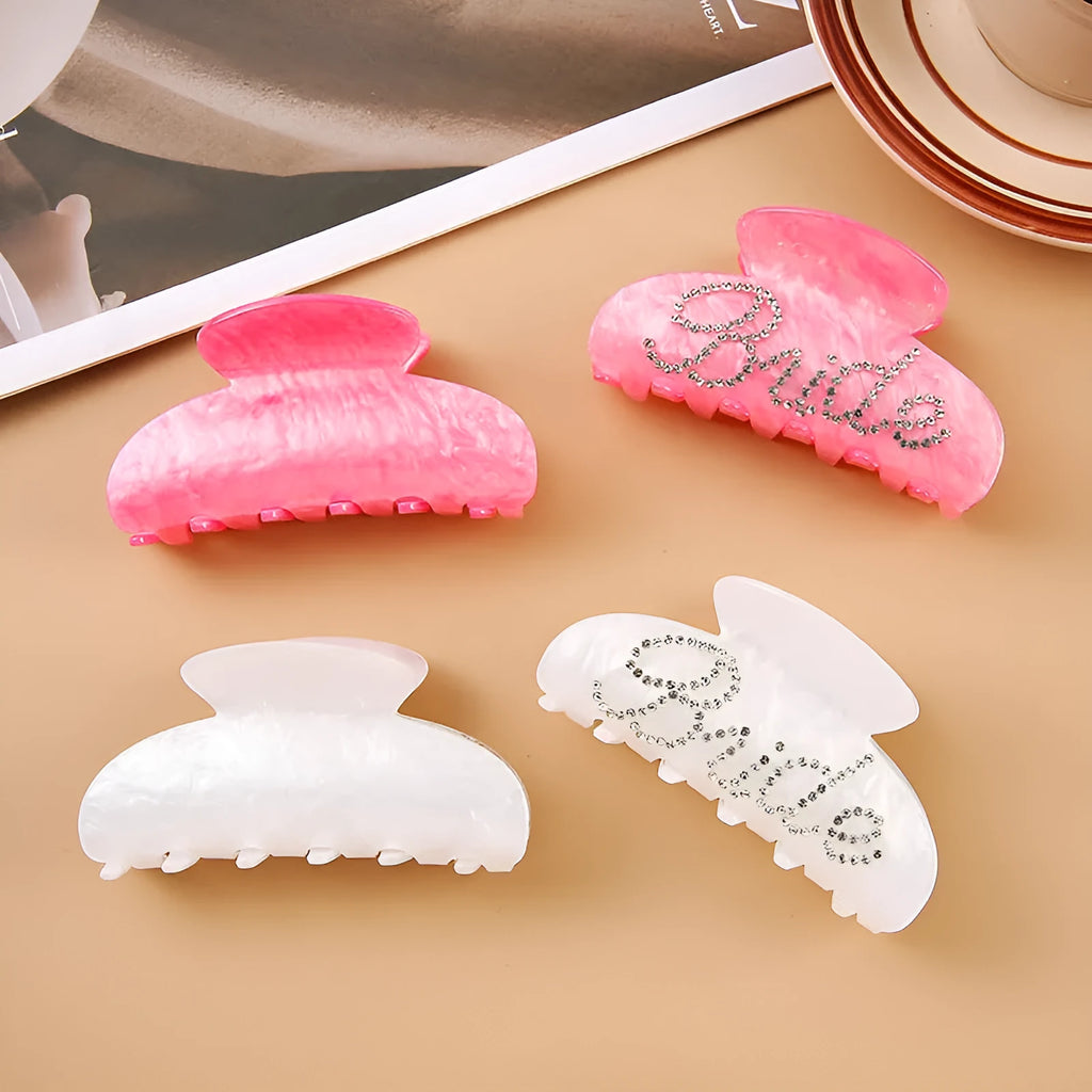 Acrylic hair barrette with sparkling diamond spot drills and English letters in pink or white.