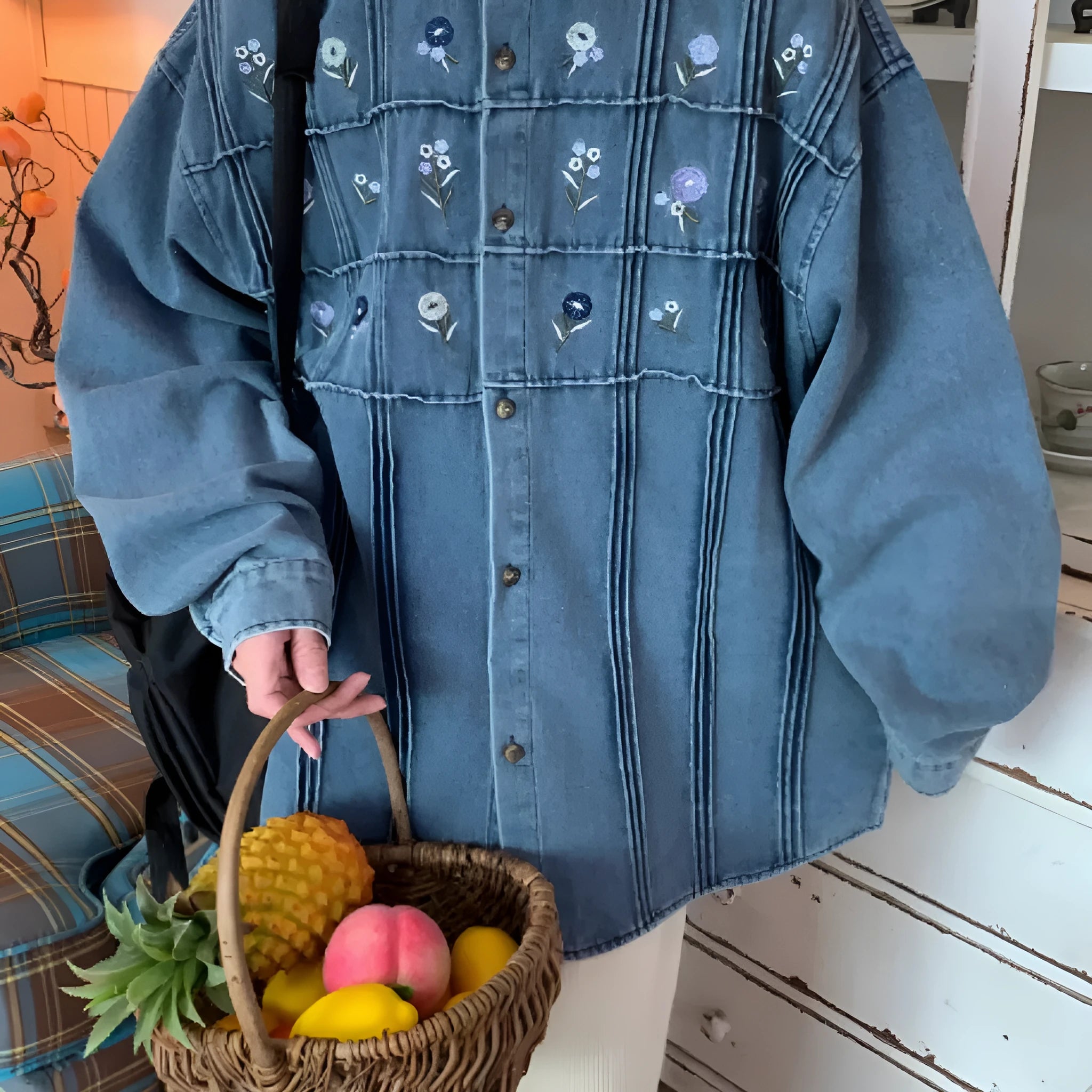Vintage washed blue denim shirt with small floral print and pleated detailing on long sleeves