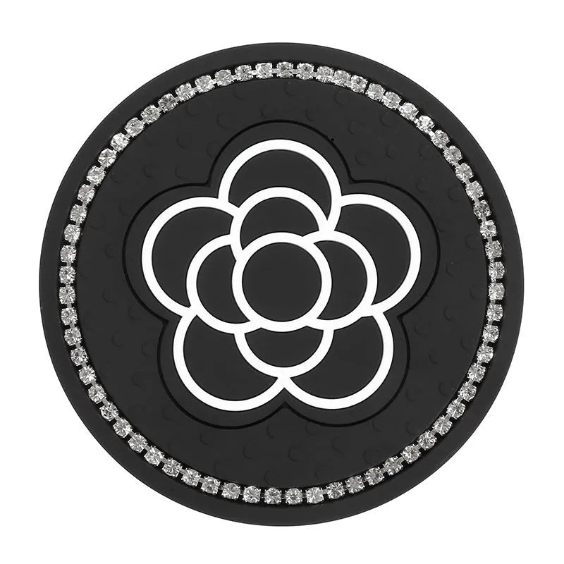 Black and white checkerboard PVC car cup holder mat inserted into vehicle centre console slot