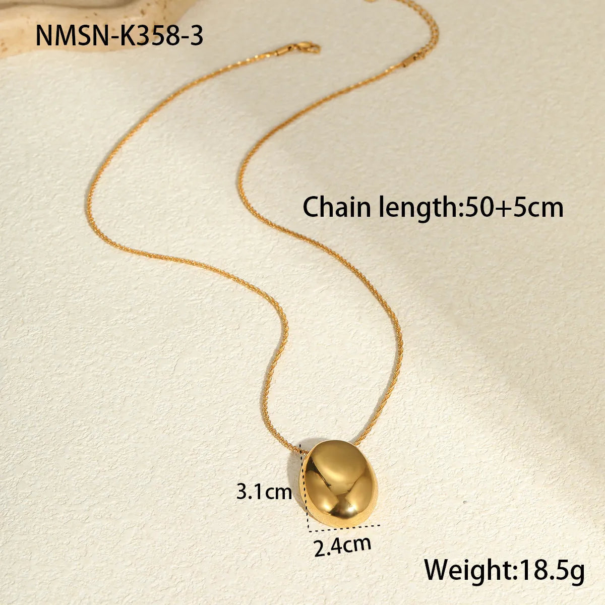 Gold-plated geometric pendant necklace with stainless steel chain on black background