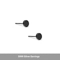 A pair of S999 sterling silver round flat stud earrings on a plain background, showing silver and black colour options.
