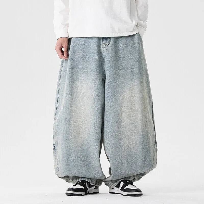 Men's plus-size light blue baggy jeans with a straight leg and zip fly