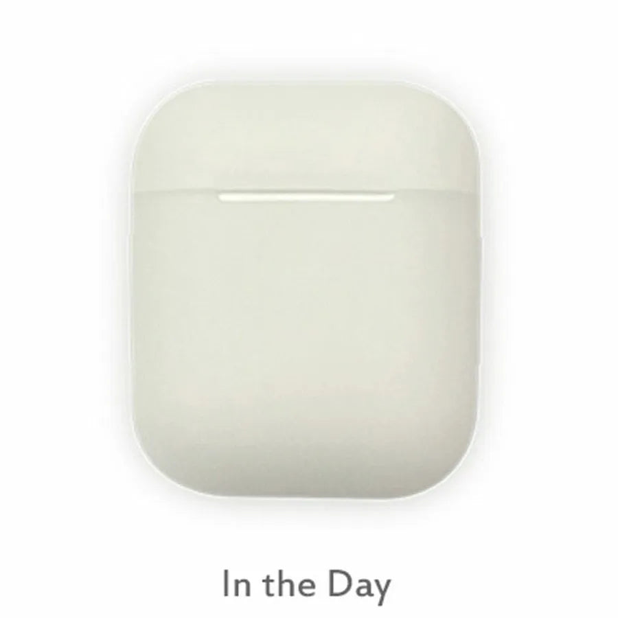 Luminous silicone protective case for Apple AirPods with flip-top design glowing in dark