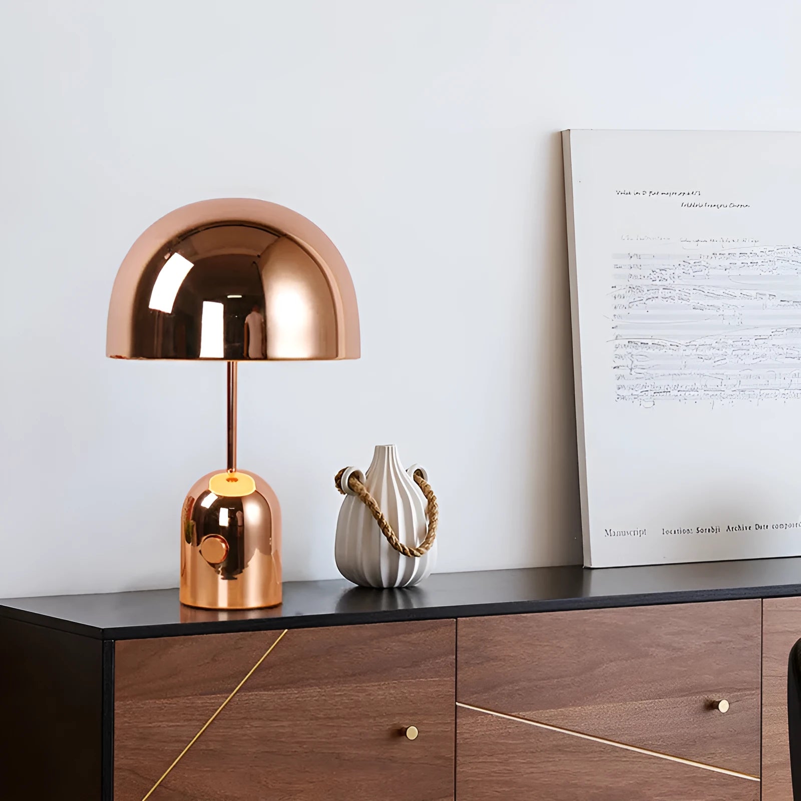 Post-modern metal base table lamp in rose gold finish measuring 280mm by 450mm