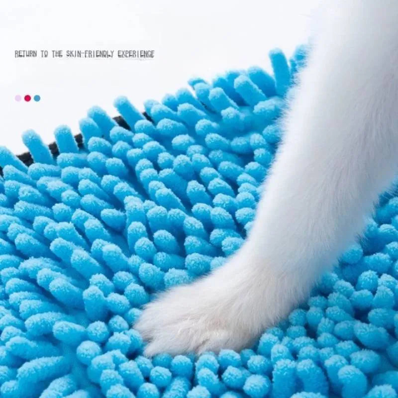 Blue pet bath robe towel for drying a dog after a wash, showing its size and soft texture.