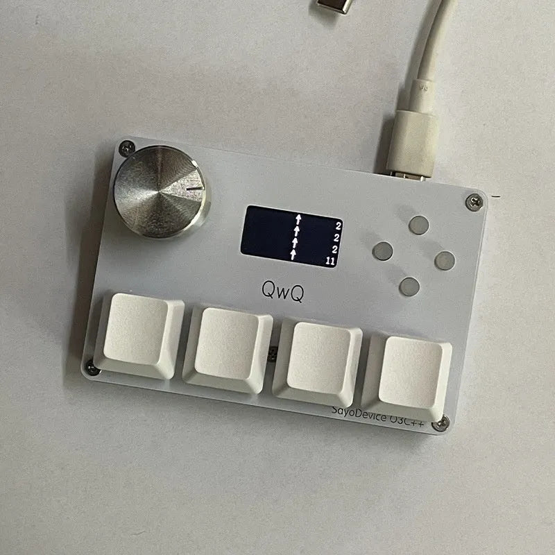 Customisable magnetic axis gaming numeric keypad with colour screen and control knob on desk