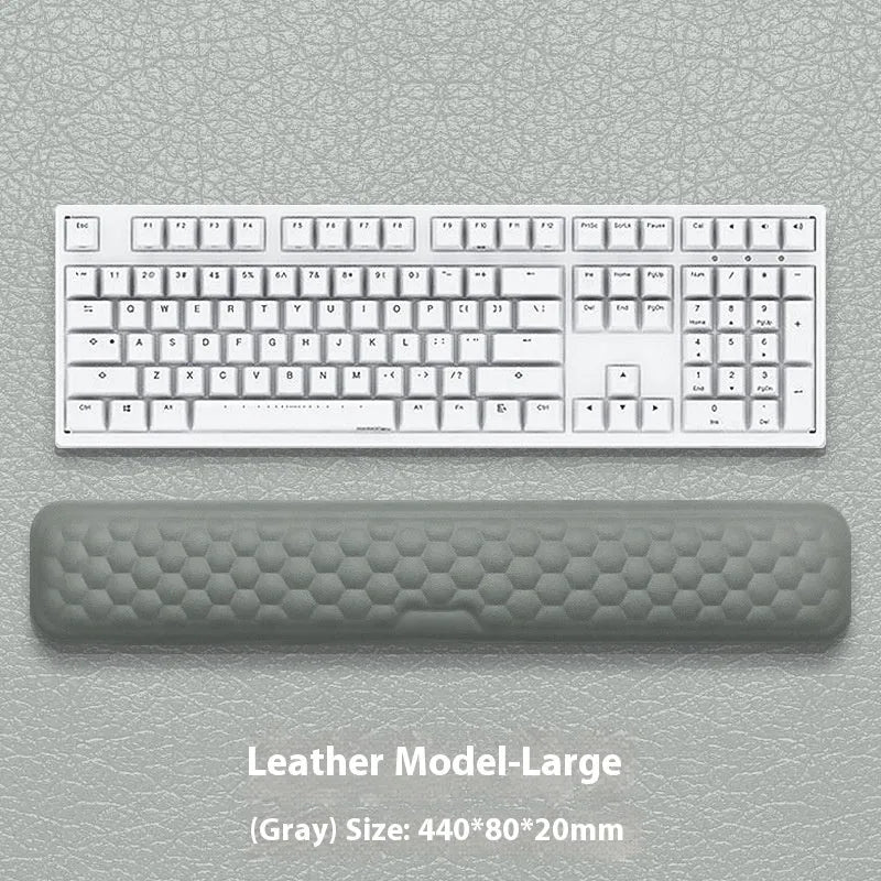 Memory foam mouse wrist rest pad with silicone base in black cloth cover option on desk