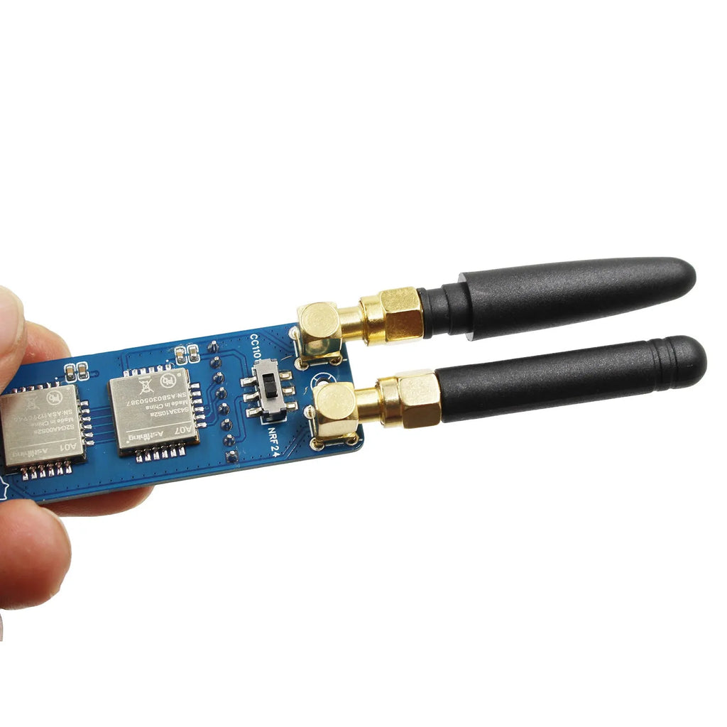M5StickC PLUS2 ESP32 module with dual antennas and groove connection cable on table