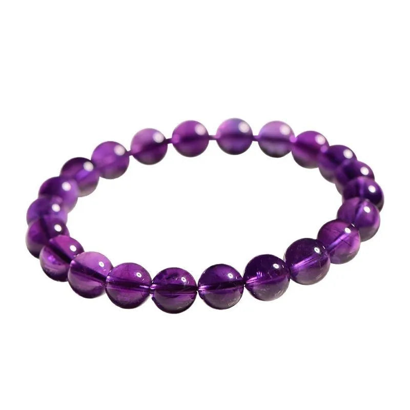 Natural amethyst Uruguay bracelet with scattered beads in various sizes on a wrist.