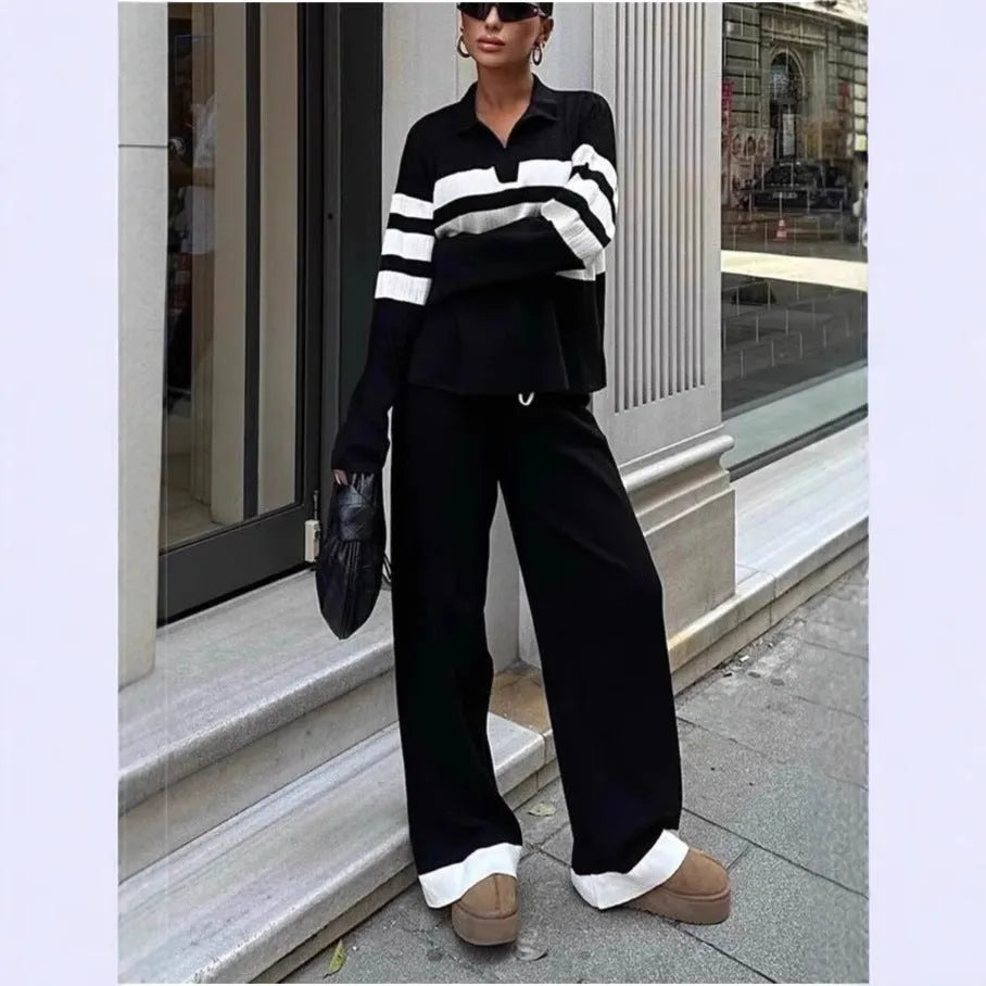 Women's black and white striped knitted two-piece set with polo collar and matching trousers