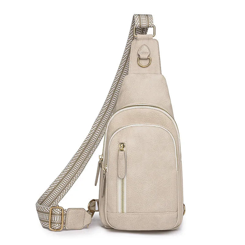 Soft brown women's crossbody chest bag showing zip compartments and street-style sewing thread detail