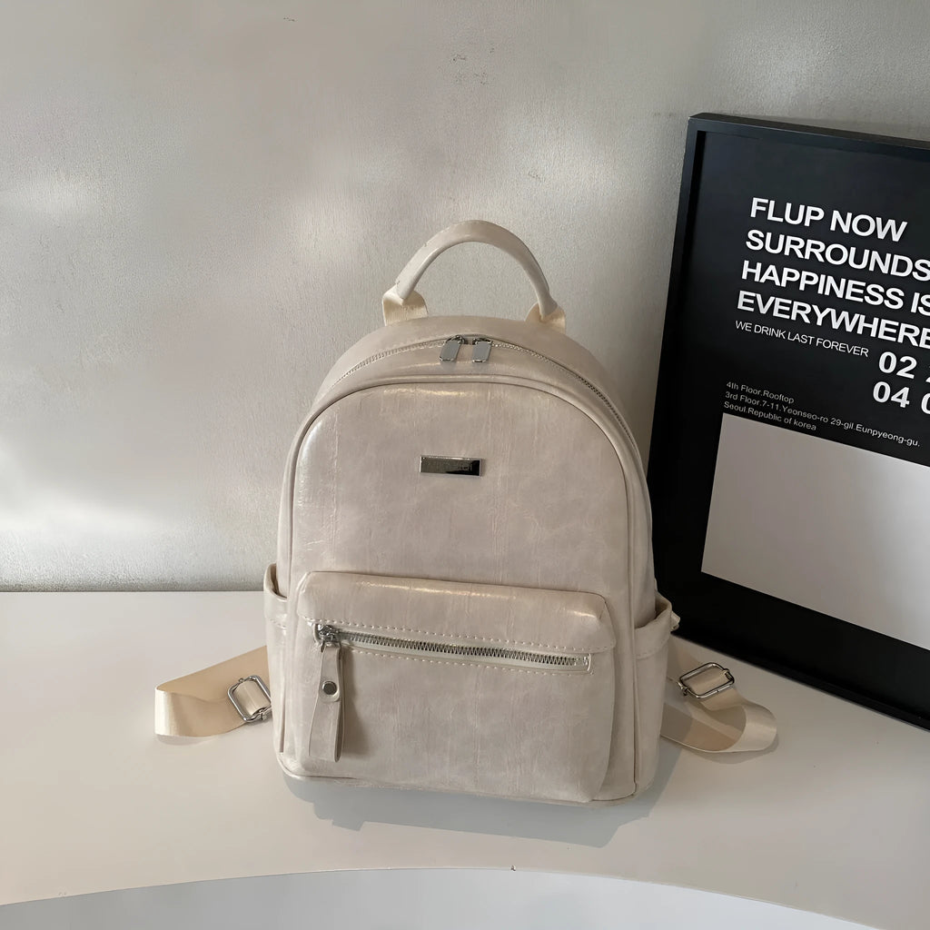 PU leather ladies travel backpack in urban simplicity style with sandwich pocket and polyester lining