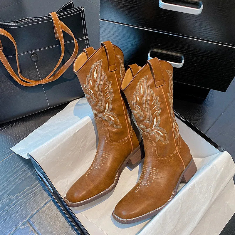 Brown women's mid-calf boots with embroidered pattern, square heel, and leather lining