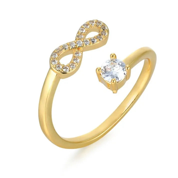 Geometric metal ring with inlaid zircon letter on finger, available in gold, rose gold, or silver.