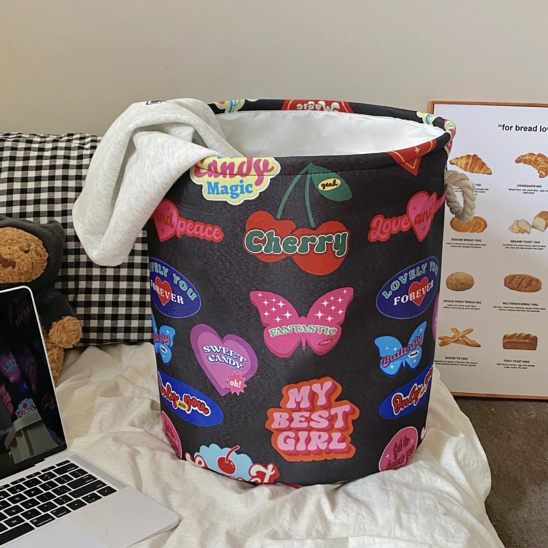 Foldable cotton laundry basket in a colourful design, shown unfolded for use.