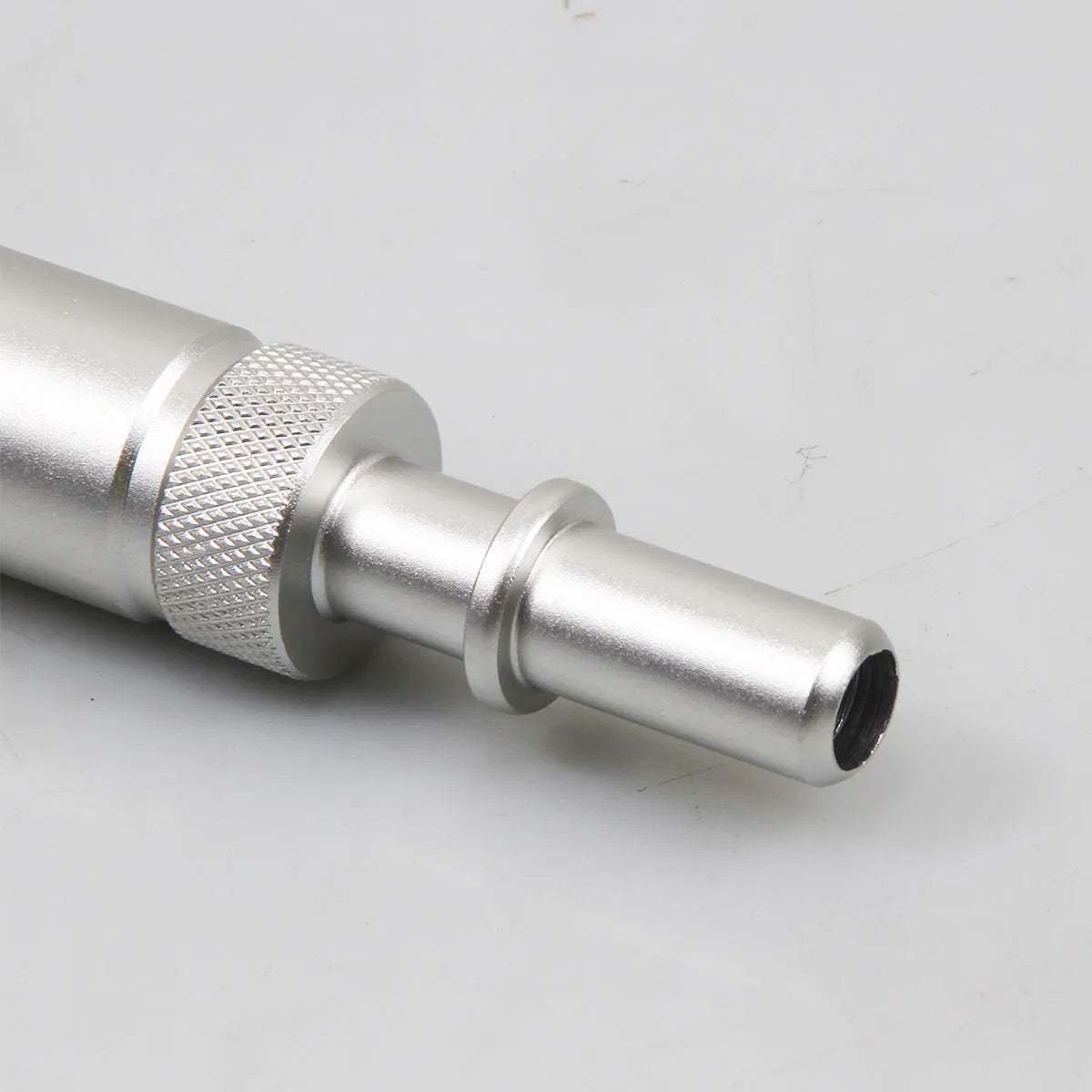 Silver metal VAS6262-9 transmission oil refueling joint adapter tool on a white background.