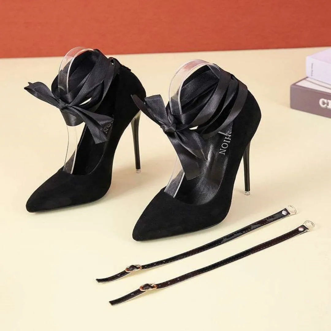 Women's black pointed toe high heel pump with a thin shallow mouth and a lace ankle strap