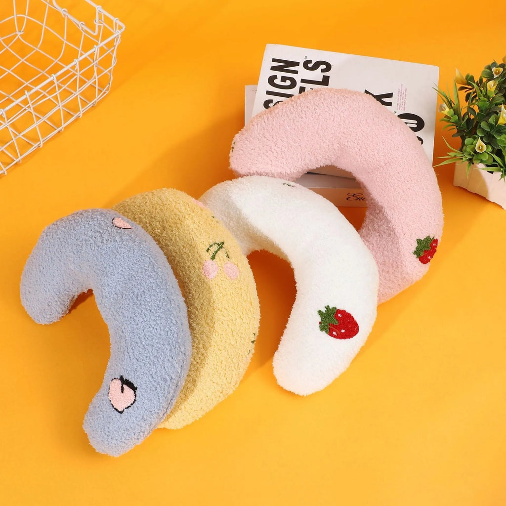 Blue half moon U-shaped cat pillow with cartoon dog and cat design for pet crates.