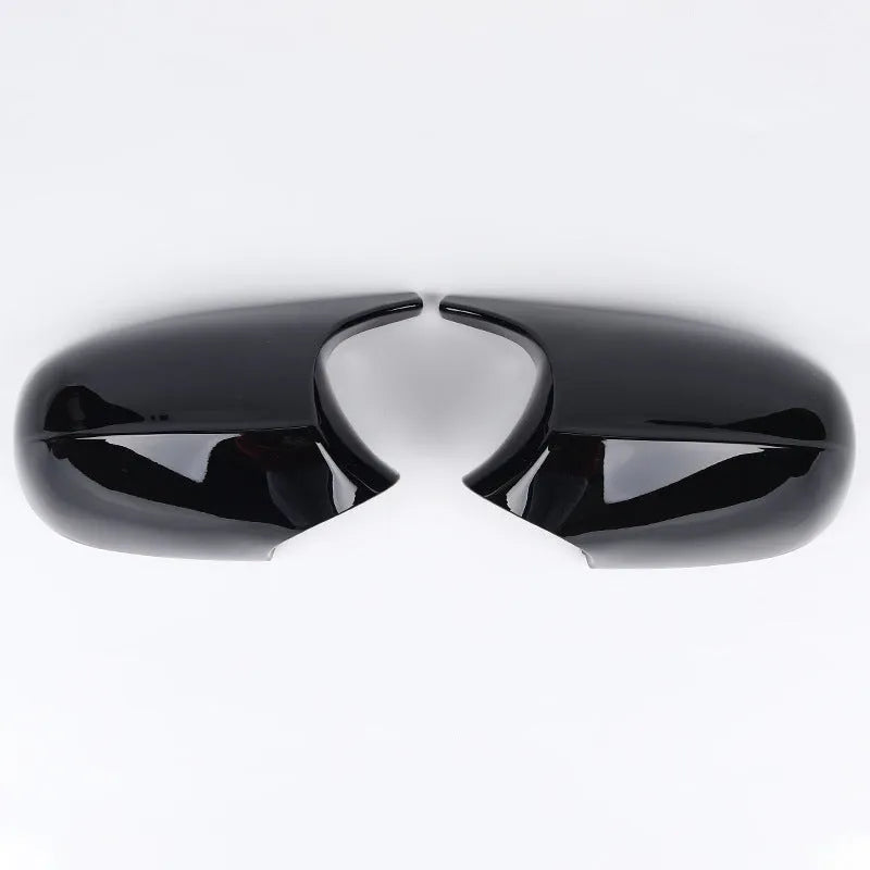 Pair of black ABS plastic rearview mirror shells for BMW 3 Series E90, shown alongside original equipment part numbers.