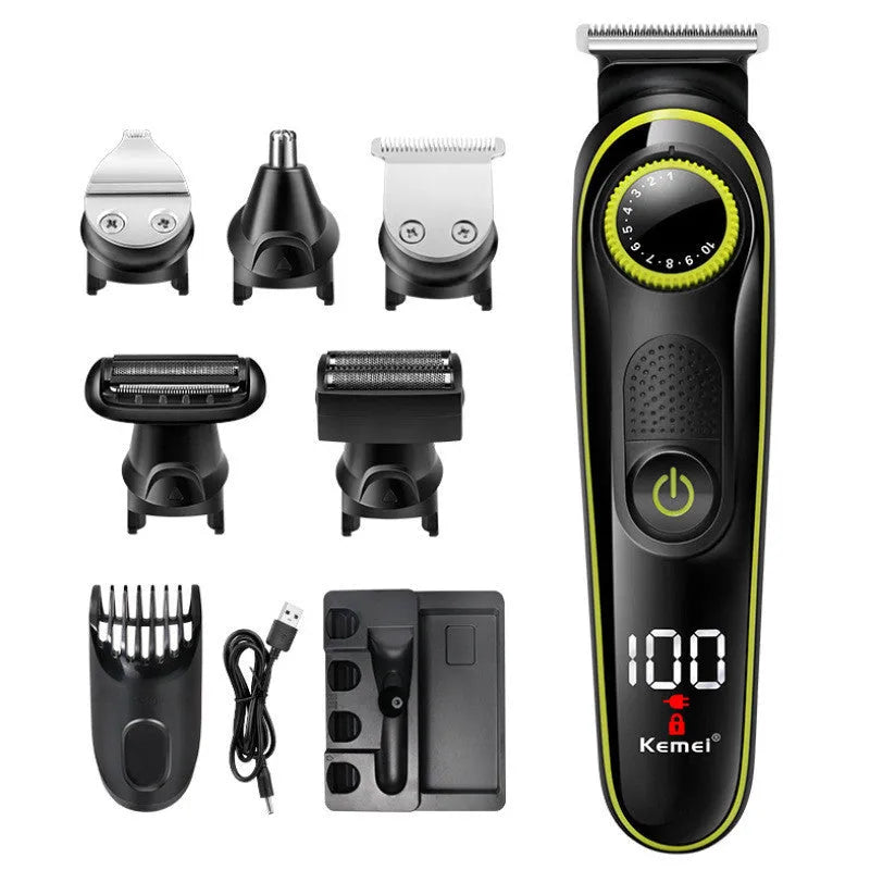 Black KM-696 USB rechargeable electric hair clipper set with stainless steel blades and accessories on a cloth
