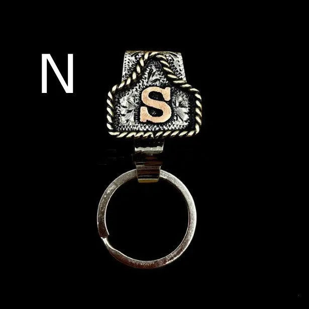 Handmade metal cow tag belt key holder with personalised alphabet letter