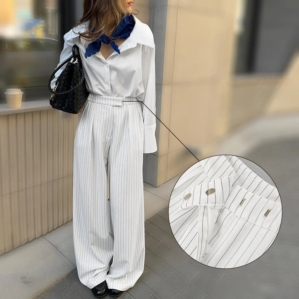 White striped wide-leg women's trousers with zipper, loose fit for commuting.