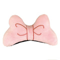 Soft plush bow tie decoration for a motorcycle or ski helmet in red, peach pink, and rose pink colours.