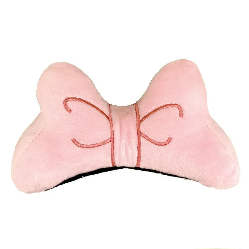 Soft plush bow tie decoration for a motorcycle or ski helmet in red, peach pink, and rose pink colours.