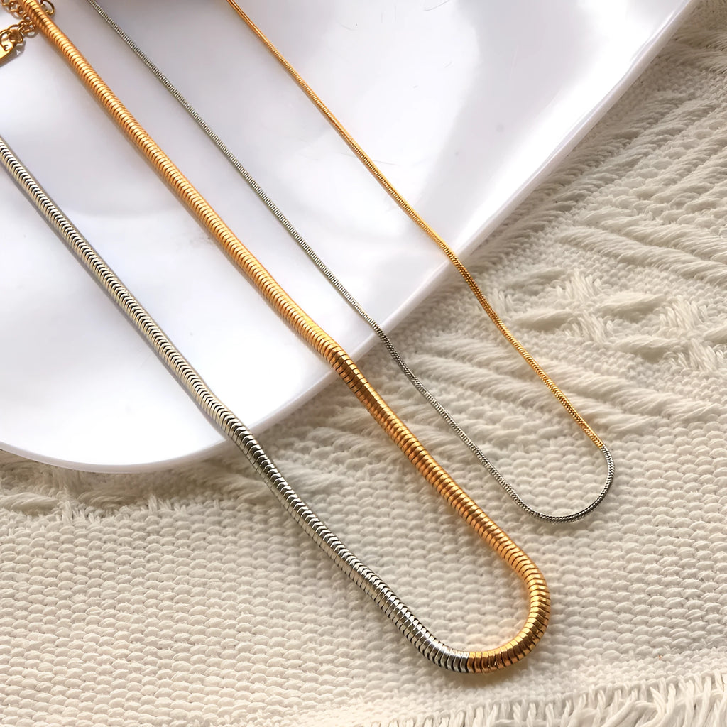 Gold-coloured stainless steel snake chain necklace for women, 3mm wide with geometric links.