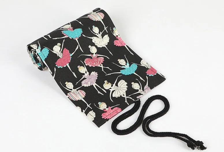 Ballet girl printed canvas roll-up pencil case unrolled to show multiple coloured pencils in slots