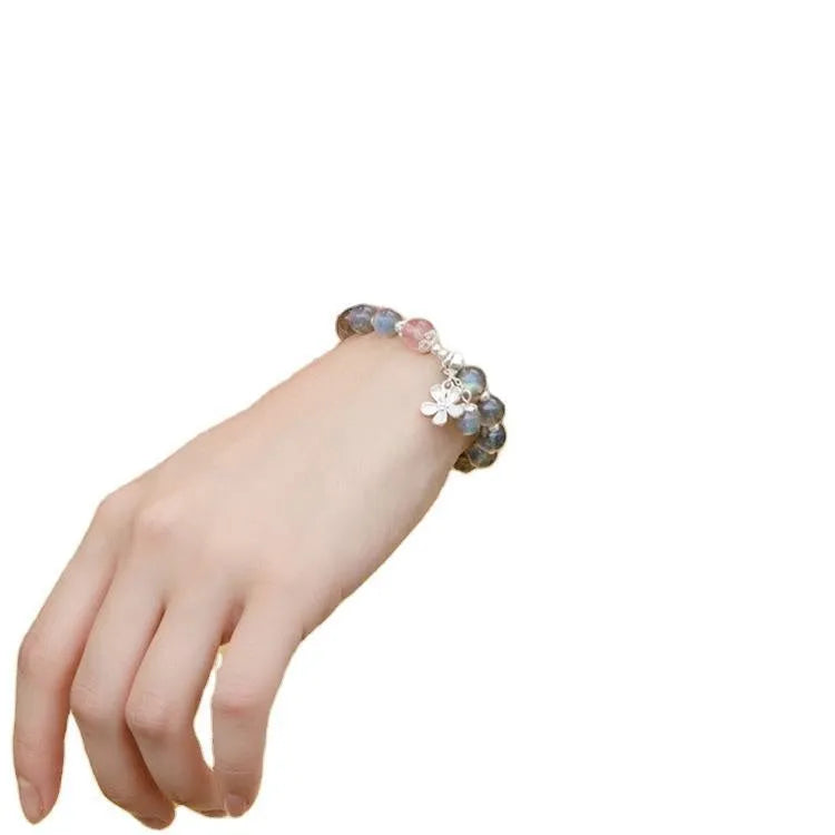 Women's moonstone bracelet with 7.5mm grey stone, red quartz accents and sterling silver