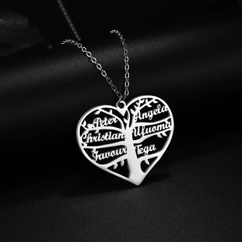 Custom stainless steel necklace with a life tree and hollow heart pendant engraved with names, shown in silver finish.