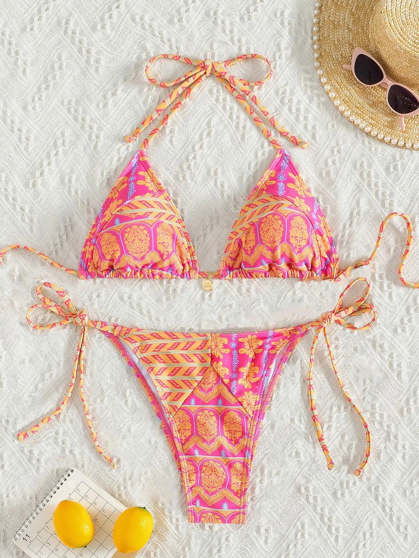 Women's split bikini swimsuit with bandage style and contrast stitching in polyester fabric