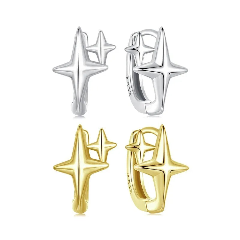 Minimalist oxidised sterling silver star ear clip with XINGX detail on a white background.