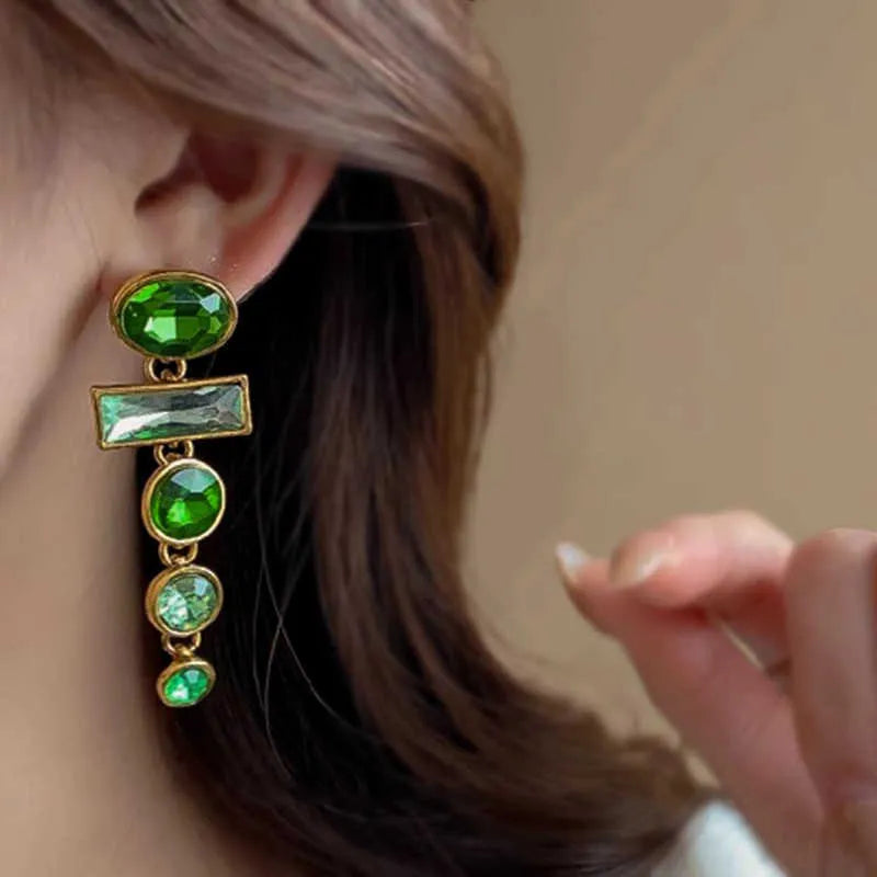 A pair of green gradient geometric drop earrings with alloy construction and inlaid zircon stones.