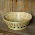 Handmade natural bamboo storage basket in a rectangular woven shape.