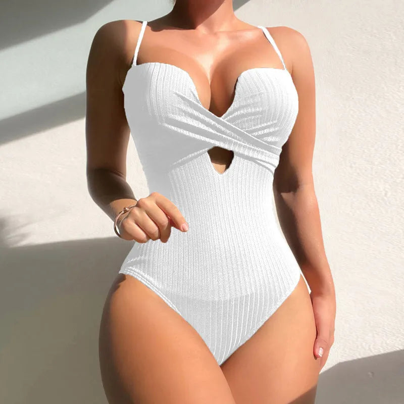 Solid colour one-piece swimsuit for women in a slim fit design.