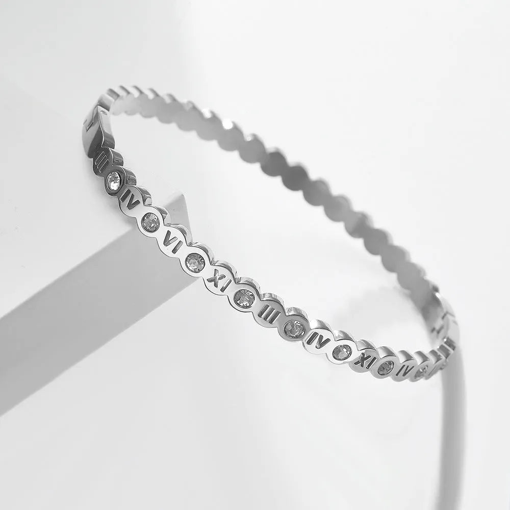 Korean style titanium steel bracelet with a numeric charm, shown in gold, rose gold, and steel colour options.